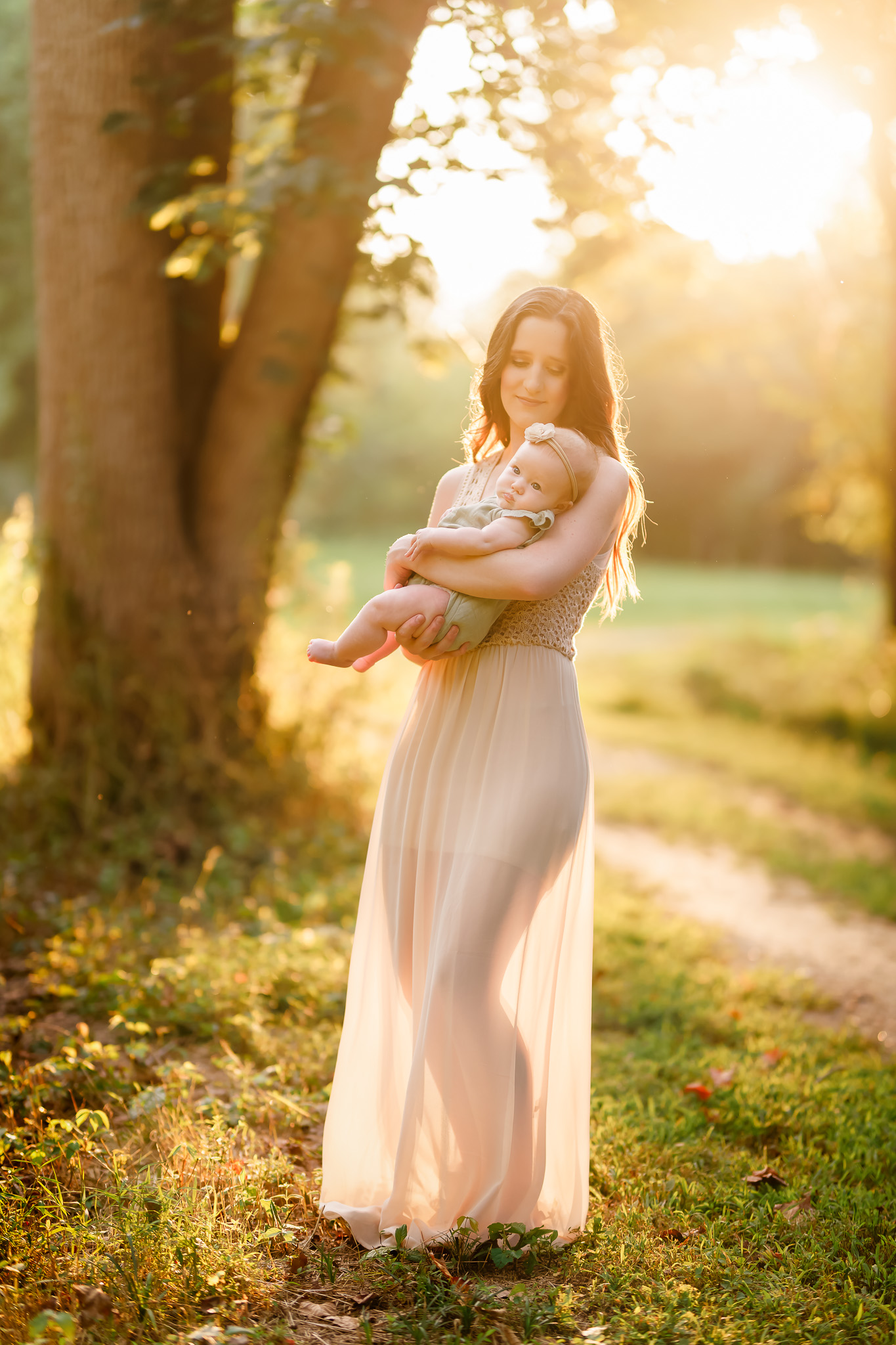 family photographers charlotte nc mother and baby in golden hour natural light portrait