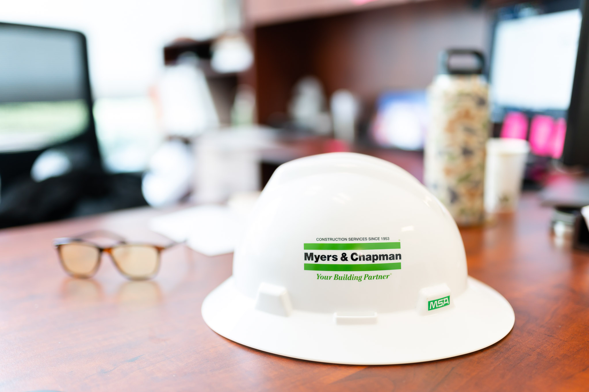 Detail shot of hardhat on a desk in an office